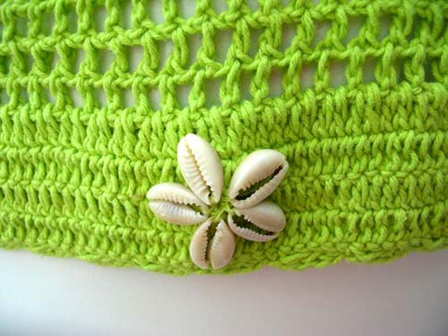 Ladies vacation clothing boutique store imports Sexy beaded knit wear halter top with seashell flower emblem from international b2b trader