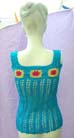 Loose knit crochet tank top with beautifully crafted flower pattern at chest from beach spring retail express b2b import store
