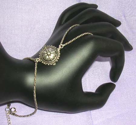 :stamped 925 sterling silver slave bracelet made in Thailand with circular mystic sign            