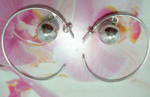 Sterling silver hoop earring with C shape holding a silver bead