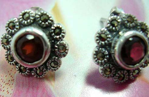 Multi mini marcasites stone forming flower sterling silver earring with a rounded garnet stone embedded in middle