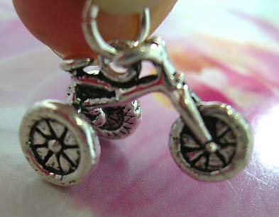 925. Thailand made solid sterling silver charm pendant in carved-out traditional 3-wheel bicycle design