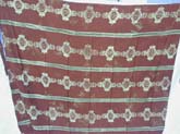 Deep brown ethic stripes wrap around long skirt